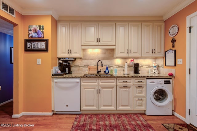 3308 Mcadams Ct, Jeffersontown, KY 40299 - kitchen with washer / dryer, dishwasher, light wood-type flooring, decorative backsplash, and crown molding