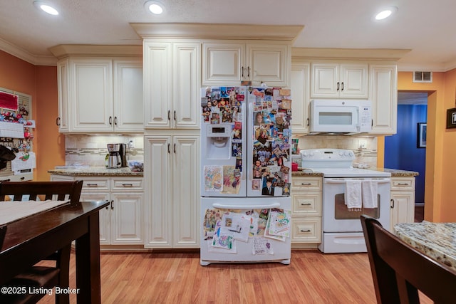 3308 Mcadams Ct, Jeffersontown, KY 40299 - kitchen with white appliances, tasteful backsplash, light wood-style floors, ornamental molding, and recessed lighting