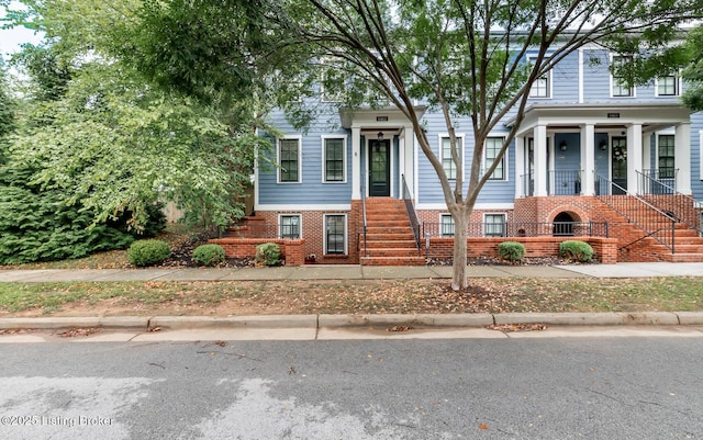 9403 Delphinium St Unit 101, Prospect, KY 40059 - view of front of property with stairs, brick siding, and a porch