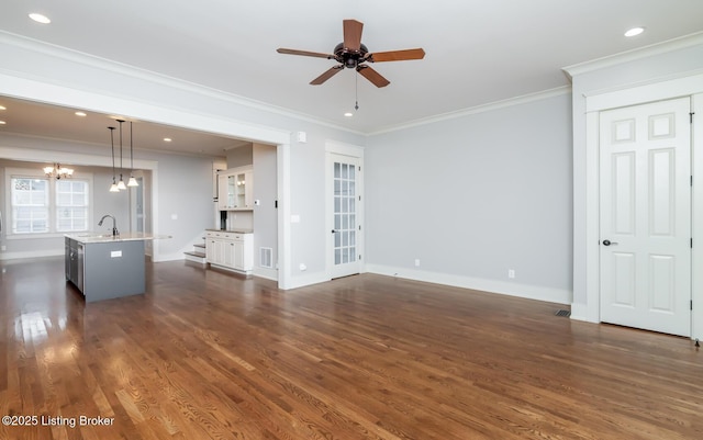 9403 Delphinium St Unit 101, Prospect, KY 40059 - unfurnished living room featuring dark wood-style flooring, a ceiling fan, ornamental molding, a chandelier, and recessed lighting