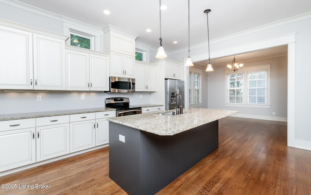 9403 Delphinium St Unit 101, Prospect, KY 40059 - kitchen featuring ornamental molding, appliances with stainless steel finishes, a center island with sink, white cabinetry, and a chandelier