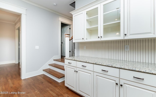 9403 Delphinium St Unit 101, Prospect, KY 40059 - bar with ornamental molding, dark wood-type flooring, and stairs