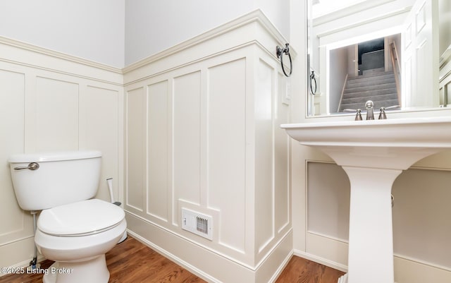 9403 Delphinium St Unit 101, Prospect, KY 40059 - bathroom featuring a decorative wall, wood finished floors, and wainscoting