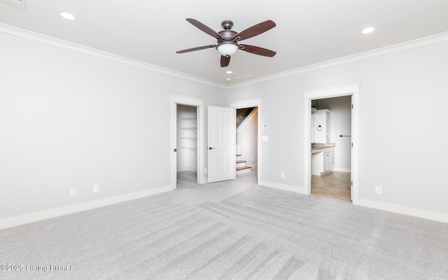 9403 Delphinium St Unit 101, Prospect, KY 40059 - unfurnished bedroom featuring crown molding, a spacious closet, light carpet, recessed lighting, and ensuite bathroom