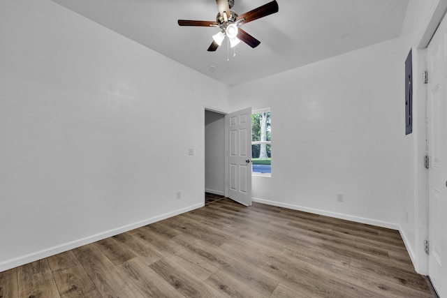 unfurnished bedroom featuring ceiling fan, baseboards, and wood finished floors