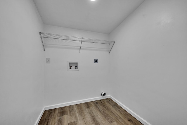 laundry room with laundry area, baseboards, washer hookup, and hookup for an electric dryer