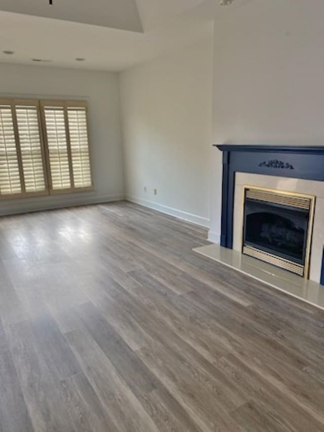 unfurnished living room with hardwood / wood-style flooring