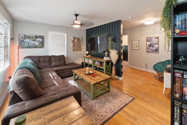  - living room with light wood-type flooring and ceiling fan