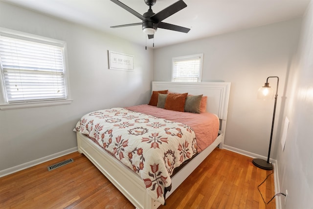  - bedroom with light wood-type flooring and a ceiling fan
