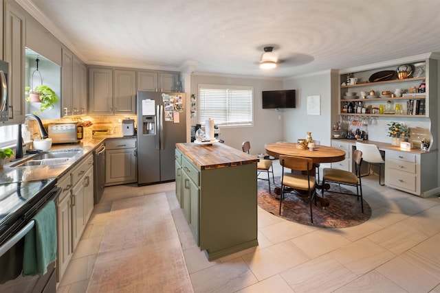  - kitchen with wood counters, stainless steel appliances, crown molding, open shelves, and decorative backsplash