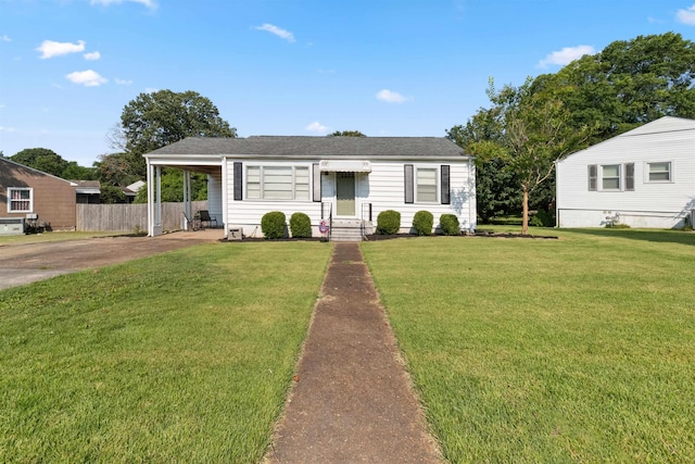  - view of front of house featuring concrete driveway, a carport, and roof with shingles