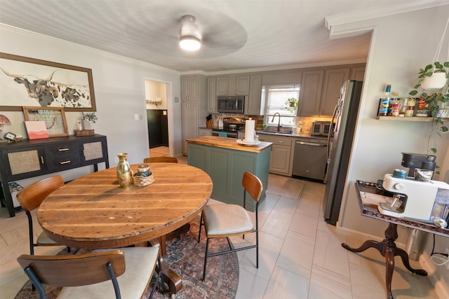  - dining space featuring ornamental molding