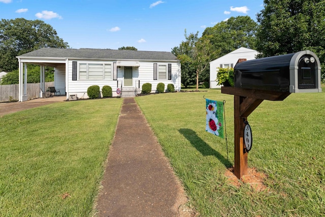  - view of front of home with an attached carport, a shingled roof, and concrete driveway