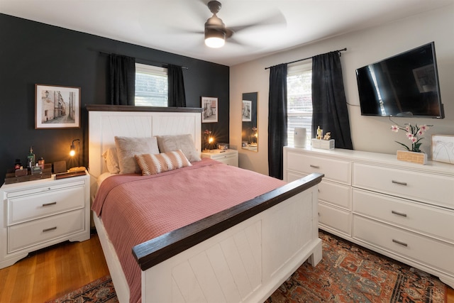  - bedroom with ceiling fan and dark wood-style flooring