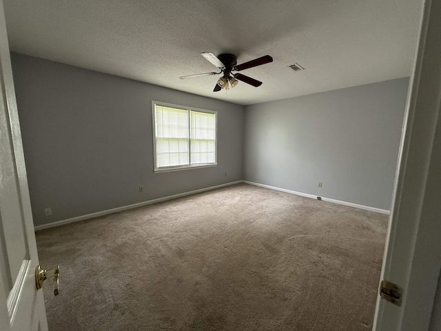  - unfurnished room featuring carpet flooring, a ceiling fan, and a textured ceiling