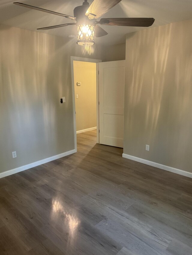 unfurnished room with dark hardwood / wood-style floors