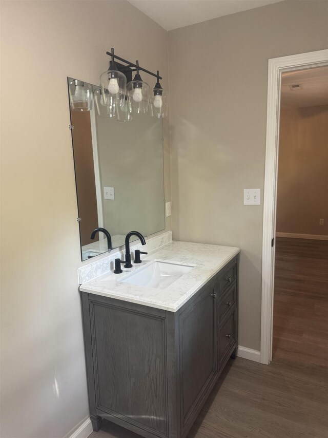 bathroom featuring vanity and hardwood / wood-style flooring