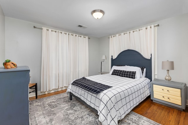 bedroom featuring dark wood-type flooring