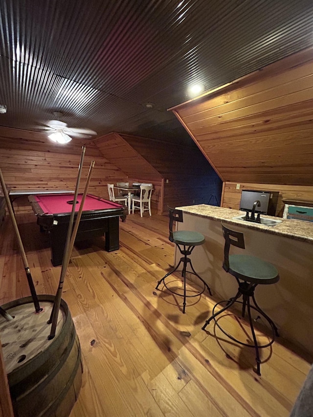 4940 Kent Rd, Tremont, MS 38876 - rec room with light hardwood / wood-style floors, vaulted ceiling, wooden walls, and billiards