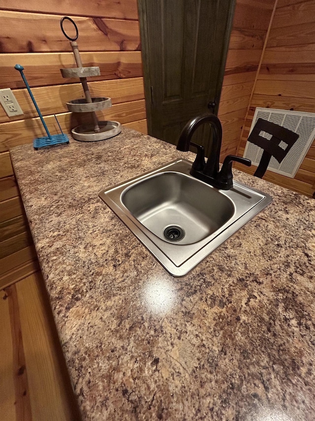 4940 Kent Rd, Tremont, MS 38876 - room details featuring wood walls and sink