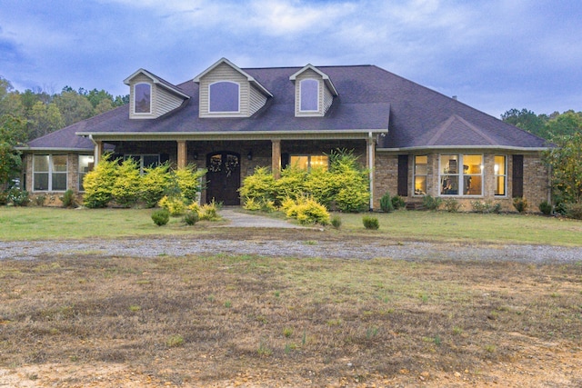 4940 Kent Rd, Tremont, MS 38876 - cape cod home featuring covered porch and a front yard