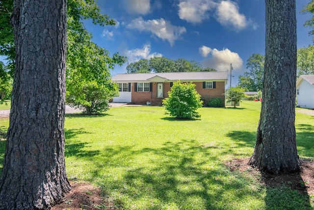  - ranch-style home with brick siding and a front yard