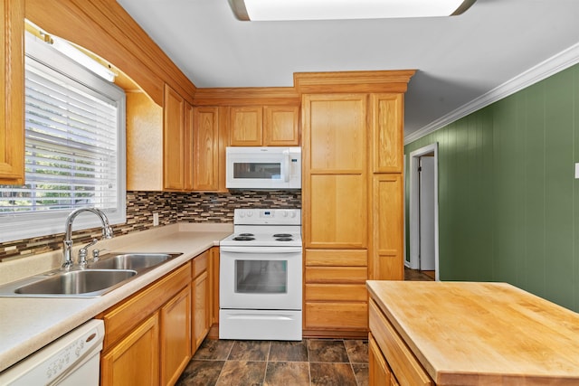  - kitchen featuring white appliances, a sink, butcher block counters, backsplash, and crown molding