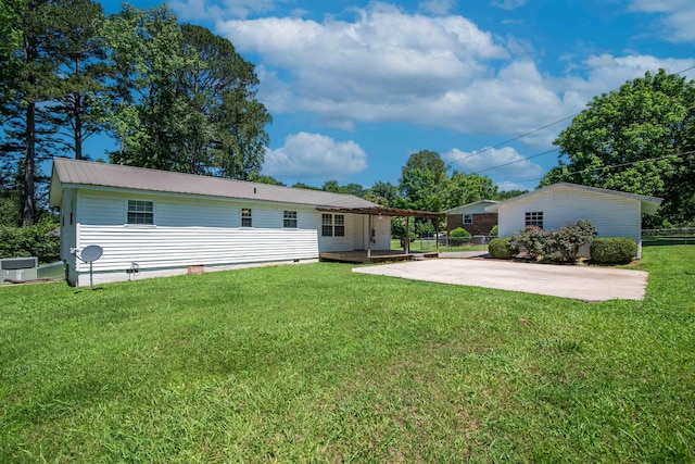  - rear view of property with a patio, metal roof, and crawl space