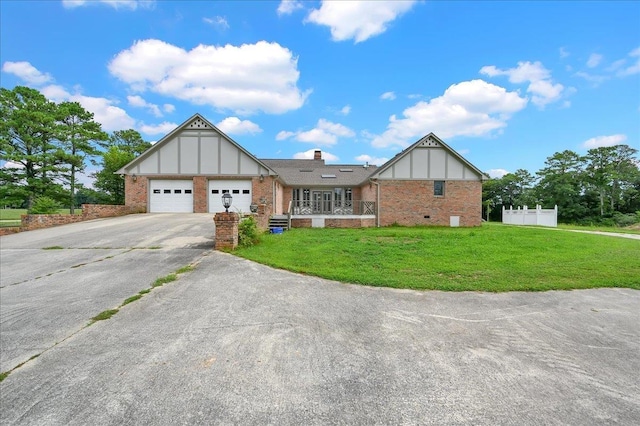 view of front of home with a garage and a front yard