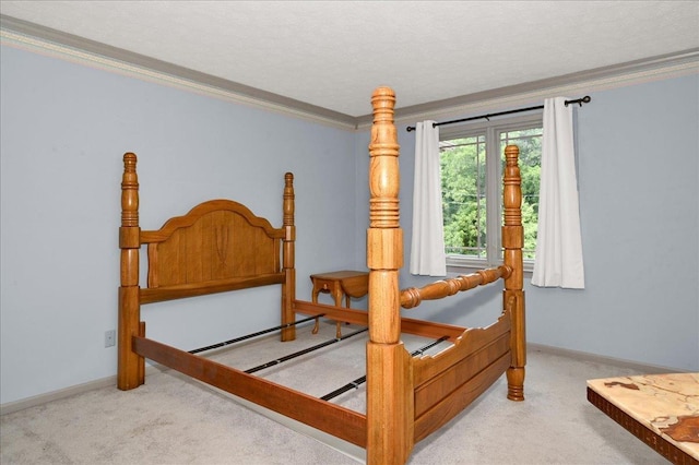 bedroom featuring crown molding and carpet