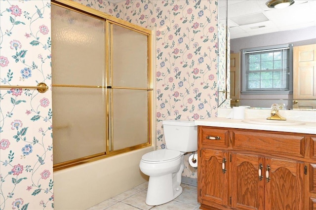 full bathroom with shower / bath combination with glass door, vanity, toilet, and tile patterned flooring