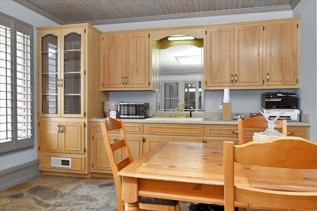 kitchen with light brown cabinets, sink, crown molding, and french doors