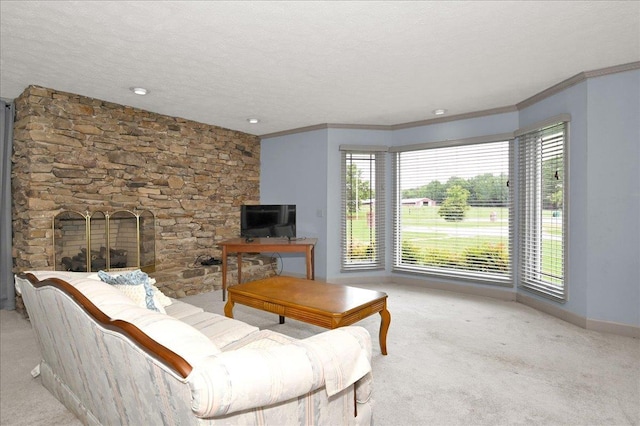 carpeted living room featuring crown molding, a fireplace, and a textured ceiling