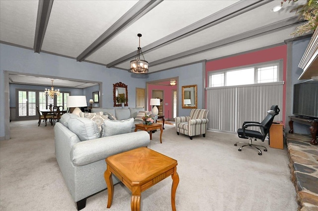 carpeted living room featuring beam ceiling and a chandelier