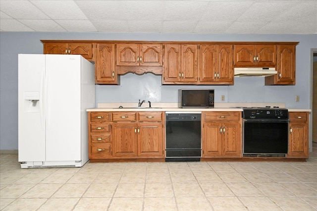 kitchen featuring sink and black appliances