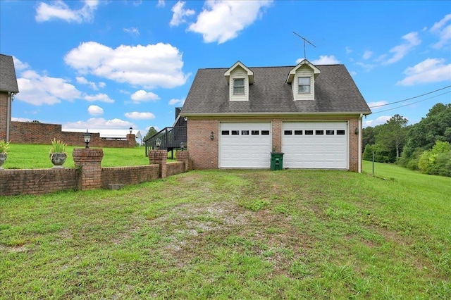 garage featuring a yard