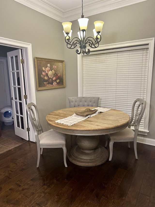 dining area with crown molding, a chandelier, and dark hardwood / wood-style flooring