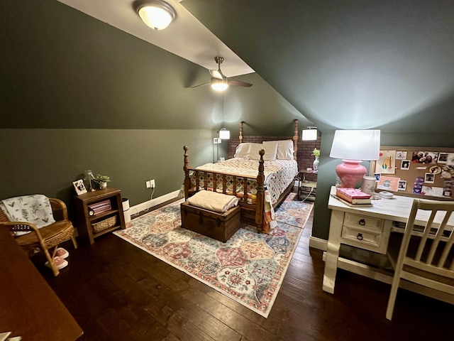 bedroom with lofted ceiling, dark hardwood / wood-style floors, and ceiling fan