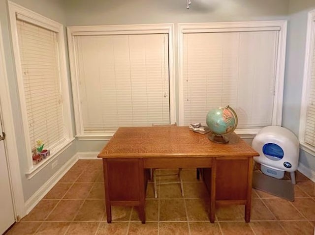 home office with dark tile patterned flooring