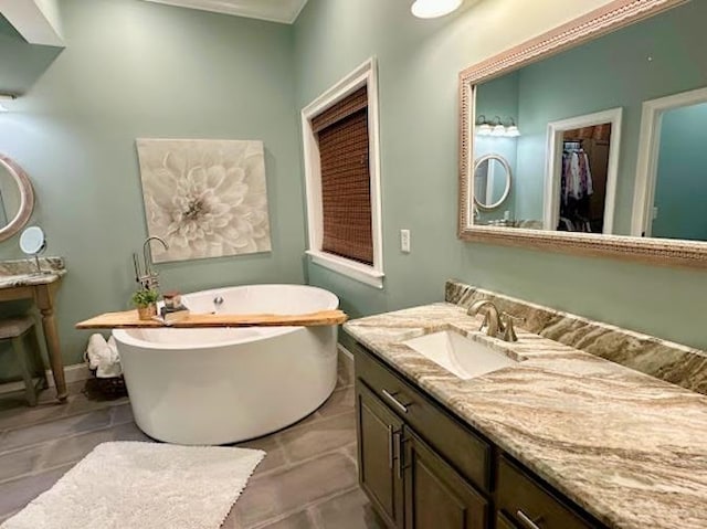 bathroom with vanity and a bathtub