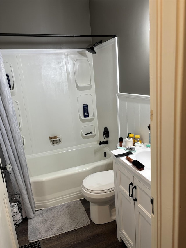 full bathroom with wood-type flooring, vanity, toilet, and shower / bath combo with shower curtain