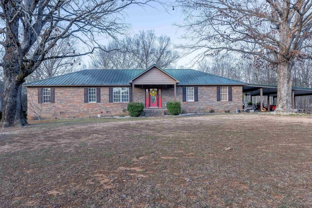 single story home with crawl space, metal roof, an attached carport, and brick siding