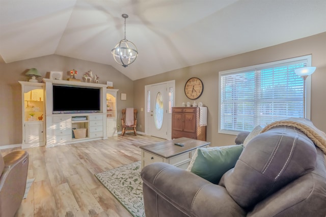 living room with lofted ceiling, light wood finished floors, baseboards, and a notable chandelier