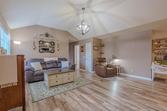 living area featuring lofted ceiling, baseboards, an inviting chandelier, and light wood-style floors