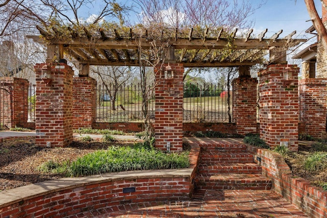 exterior space with fence and a pergola