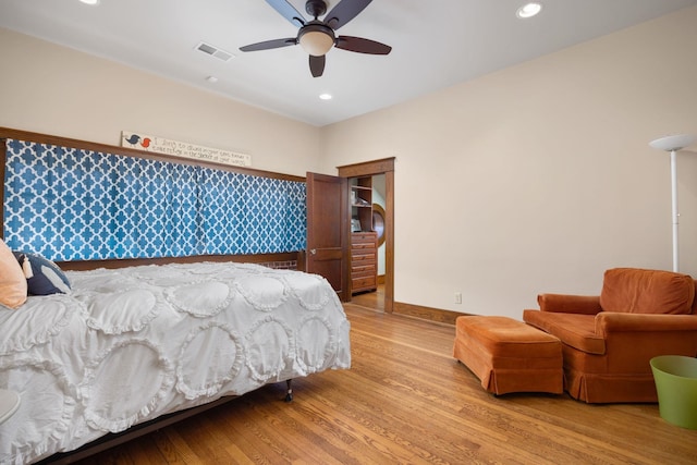 bedroom with recessed lighting, baseboards, visible vents, and light wood finished floors