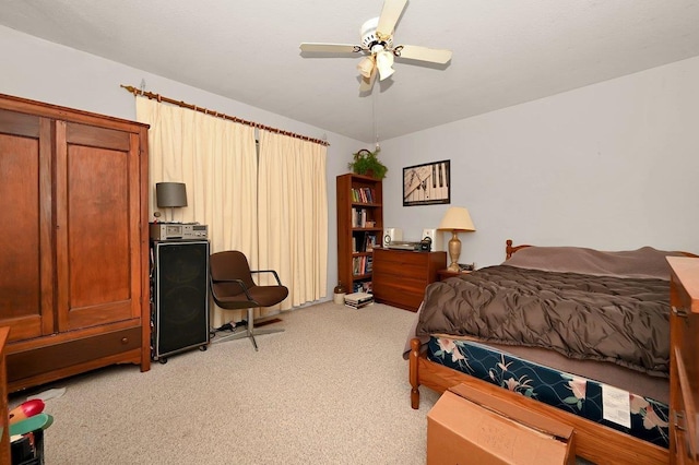 bedroom with light carpet and ceiling fan