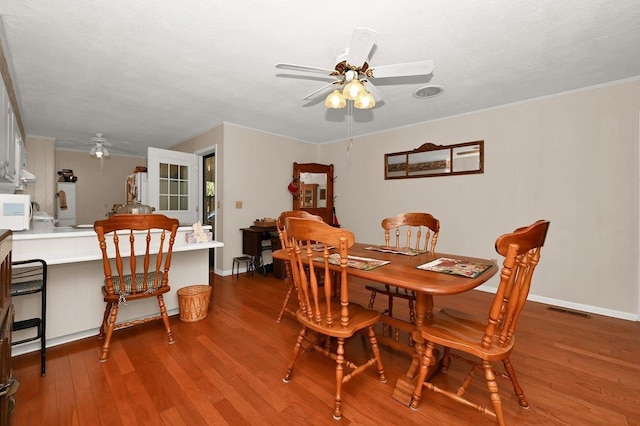 dining space featuring ceiling fan and hardwood / wood-style flooring