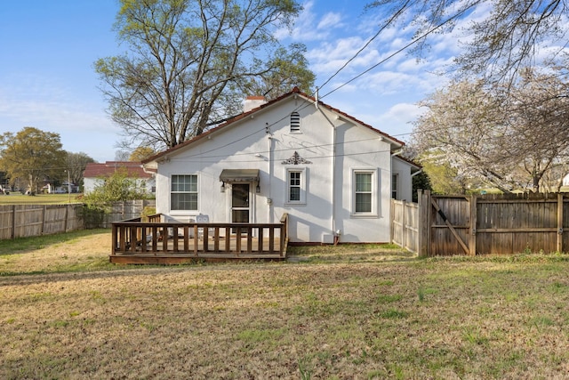  - back of property featuring a wooden deck and a chimney