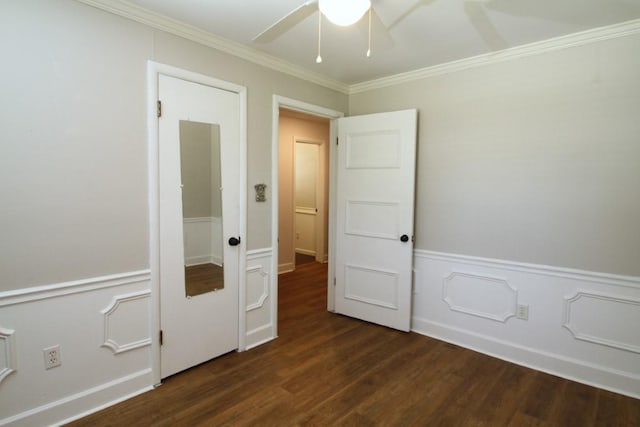 unfurnished bedroom featuring ceiling fan, dark hardwood / wood-style floors, and ornamental molding